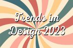 Text ‚Trends im Design 2023‘ vor Hintergrund mit vielen farbigen Linien.